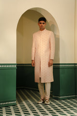 Raw silk sherwani in a soft pink hue, featuring intricate hand embroidery SW1403