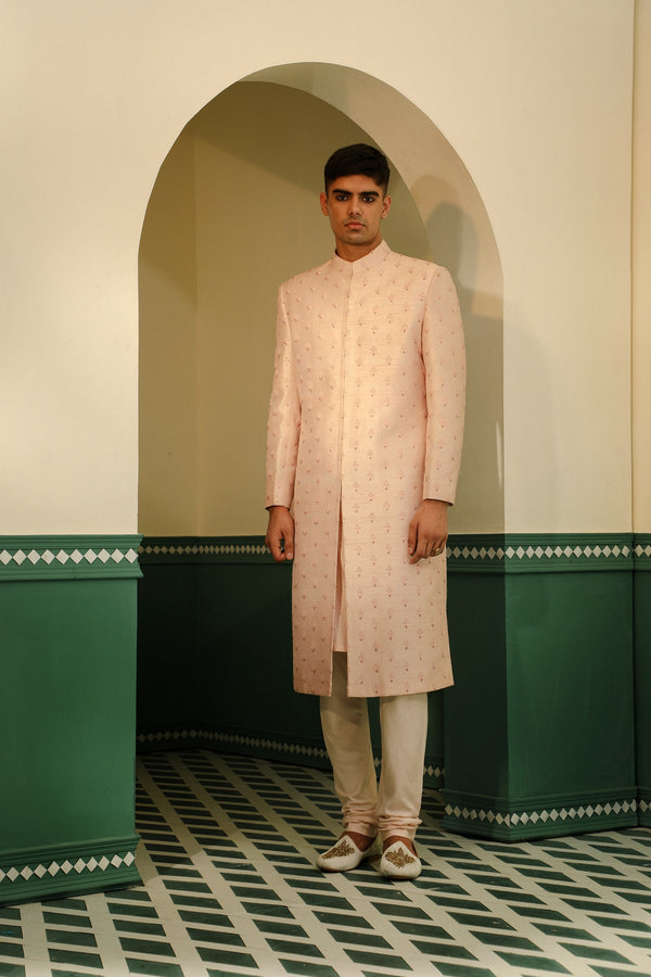 Raw silk sherwani in a soft pink hue, featuring intricate hand embroidery SW1403