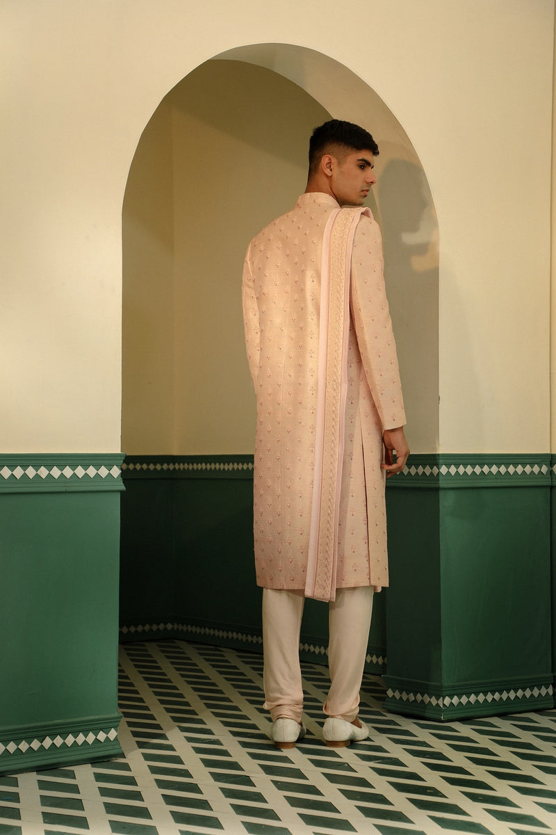 Raw silk sherwani in a soft pink hue, featuring intricate hand embroidery SW1403